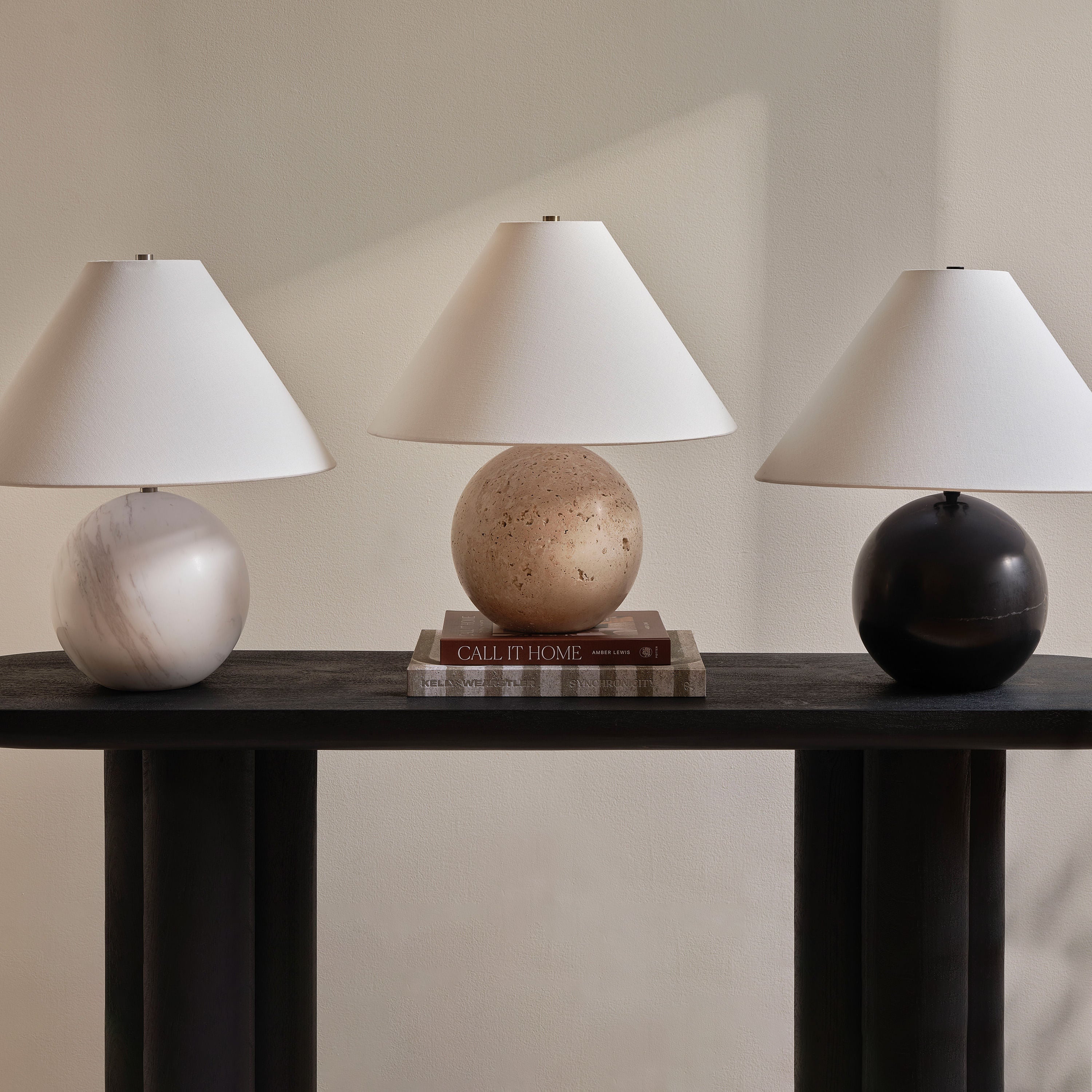 Assen table lamp by Renwil, travertine base, ivory linen shade, honed natural stone