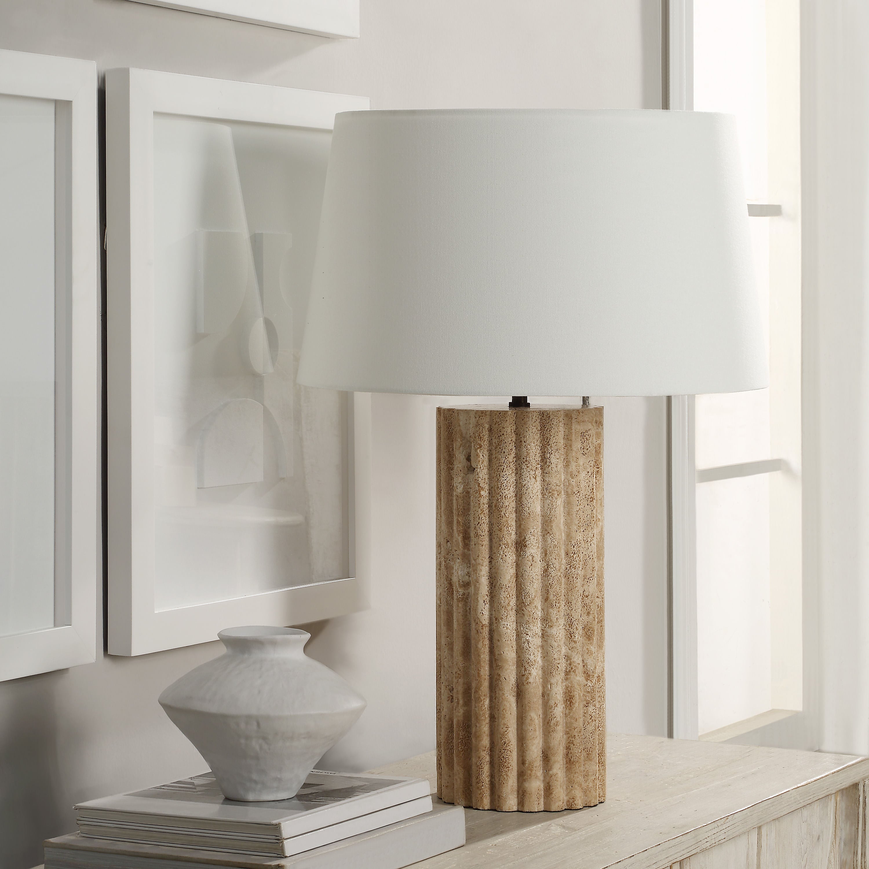 Milena table lamp by Renwil, travertine column base, ivory linen shade, fluted stone