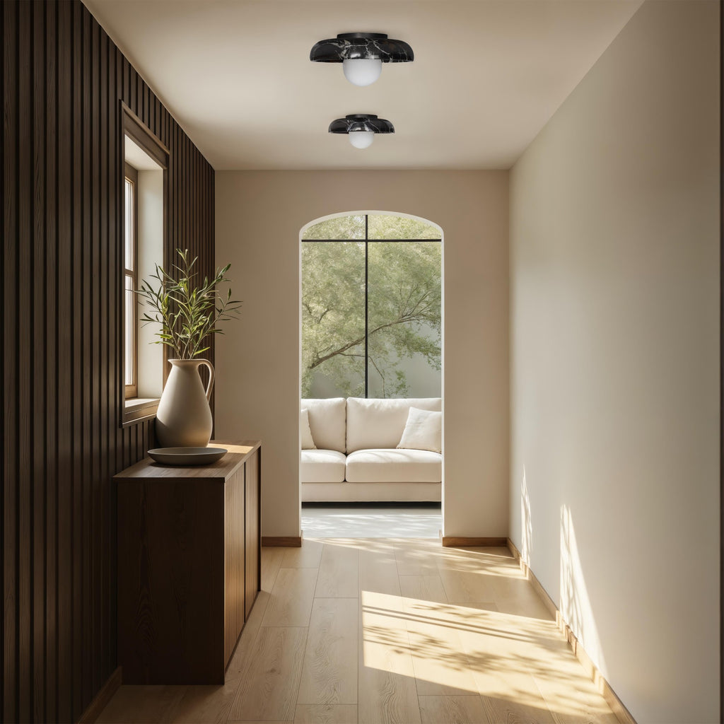 Myrtos wall sconce by Renwil, black marble, dark bronze finish